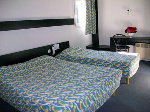 Hotel Le Chavanon tesisinde bir odada yatak veya yataklar