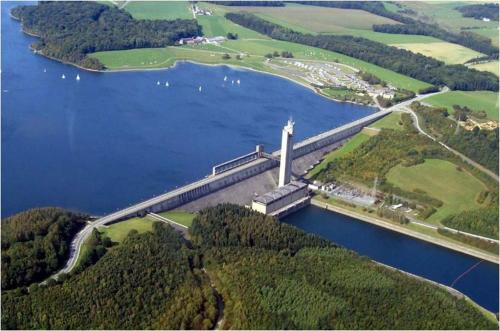an aerial view of a bridge over a lake at Le Clos Fleuri in Sautin