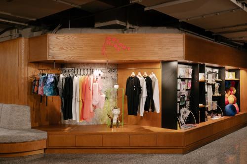 a clothing store display with clothes on racks at Eaton HK in Hong Kong