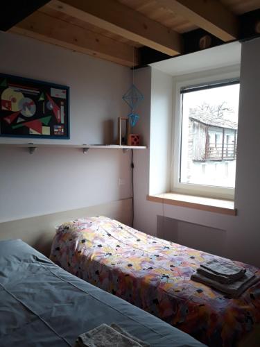 Postel nebo postele na pokoji v ubytování Foresteria B&B Vecchiascuola Pianazzola