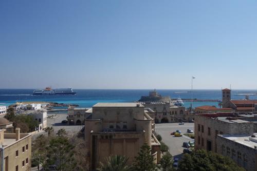 a view of a city with the ocean in the background at Rhodos Horizon City-Adults Only in Rhodes Town