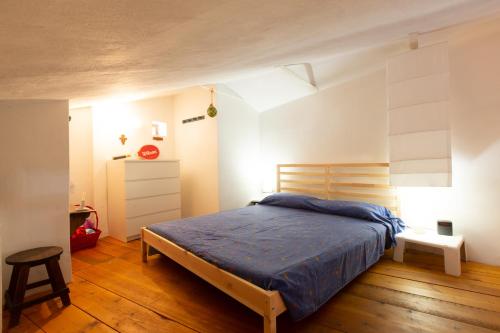 Postel nebo postele na pokoji v ubytování Cosy loft - Loft di atmosfera in Sperlonga alta