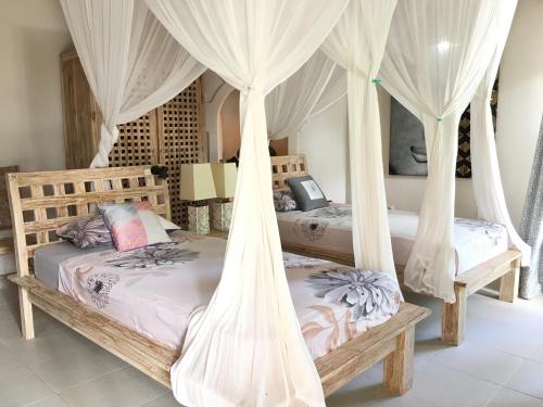 Postel nebo postele na pokoji v ubytování Felicianas Resort