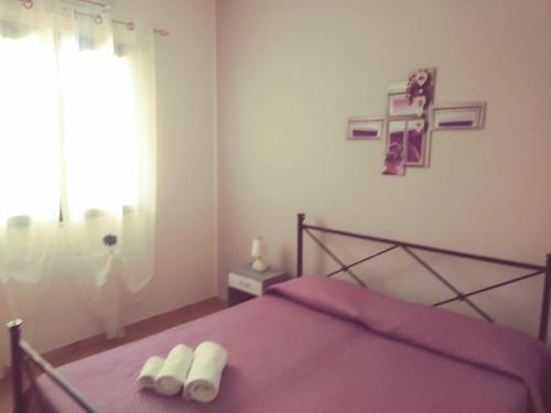 Postel nebo postele na pokoji v ubytování Villa Fontane Bianche