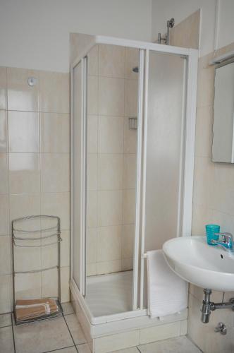 a bathroom with a shower and a sink at La Contrada in Sarnico