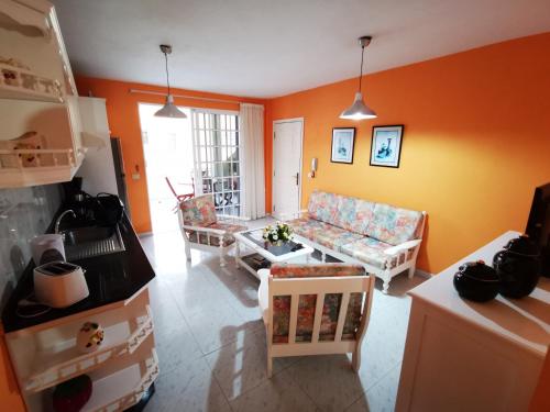 a living room with a couch and a table at Apartamento Candil in Puerto Naos