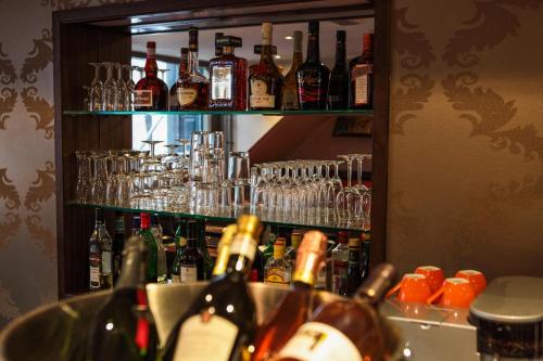 a bar with many bottles of alcohol and glasses at Prinsengracht Hotel in Amsterdam