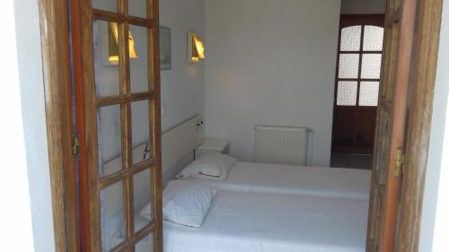 Postel nebo postele na pokoji v ubytování Amaliahotel