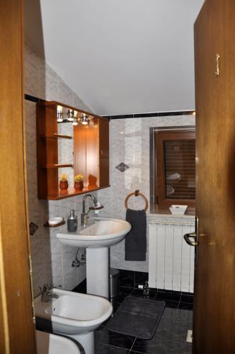 a bathroom with a sink and a toilet at BBP apartment in Portorož
