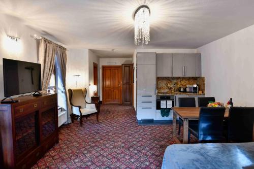 a living room with a kitchen and a dining room at Bed&Bike Prachatice in Prachatice