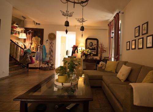 a living room with a couch and a table at Boutique Hotel Kentrikon & Bungalows in Agios Ioannis Pelio