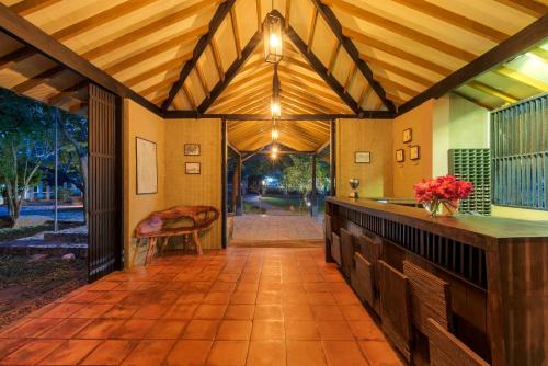 an open entry way to a home with a wooden ceiling at Hotel Elephant Reach in Yala