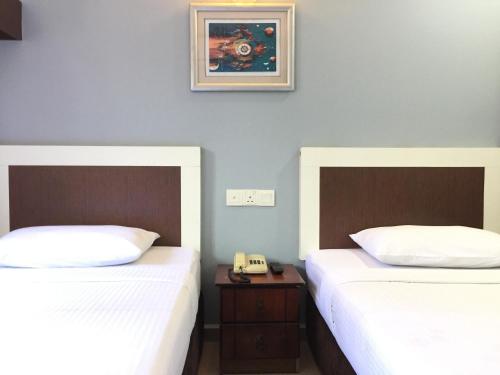 Postel nebo postele na pokoji v ubytování CK Hotel