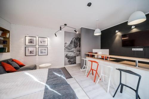 a kitchen and living room with a table and chairs at Revelton Studios Karlovy Vary in Karlovy Vary