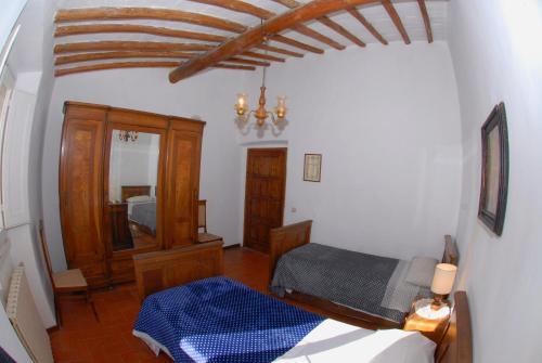 a bedroom with a bed and a mirror in a room at Agriturismo I Poggi in Impruneta