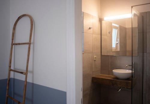 a bathroom with a sink and a shower at Avali luxury houses in Gaios