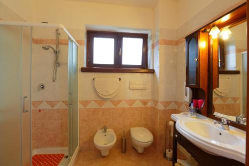 a bathroom with a sink and a toilet and a shower at Soggiorno Boccuti in Montella