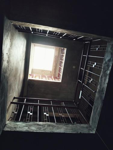an empty oven with a window in a room at GOIN Old House & Bar in Tainan