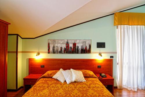 a bedroom with a bed with two pillows on it at Soggiorno Boccuti in Montella