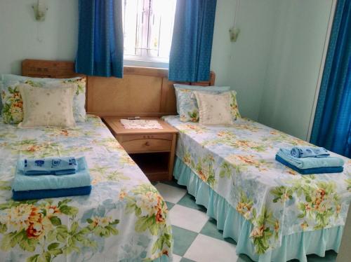 Postel nebo postele na pokoji v ubytování Fayruz Villa is a 3 bedroom, 3 bathroom detached house with AC and swimming pool 5 minutes walk from Flic en Flac public beach