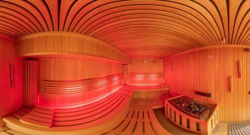 a large room with red lights on the inside at Insel Hotel Bonn - Superior in Bonn