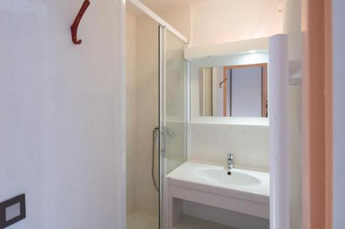 a bathroom with a sink and a mirror at VVF Résidence Les Angles Pyrénées in Les Angles