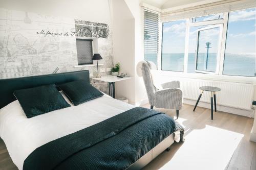 A bed or beds in a room at The Beach 