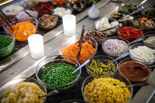 a buffet filled with lots of different types of food at First Hotel Royal in Säffle