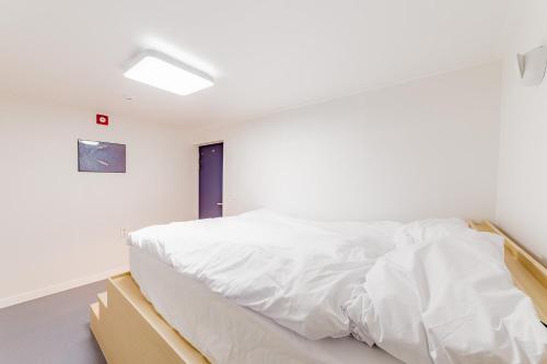 Ένα ή περισσότερα κρεβάτια σε δωμάτιο στο Guesthouse Dear Moon