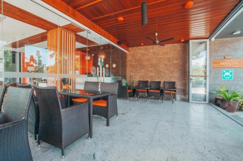 a dining room with chairs and a table in a building at Paralian Hulhumale' in Hulhumale