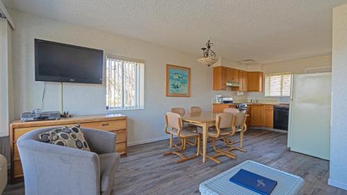 a kitchen and dining room with a table and chairs at Sea Crest in Amagansett