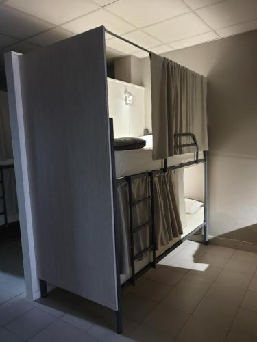 an open door to a room with bunk beds at Albergue Porta Real NO BIKE STORAGE in Santiago de Compostela
