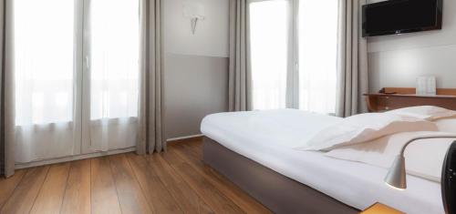 Katil atau katil-katil dalam bilik di Hôtel Du Lion
