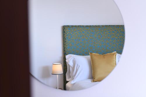 Katil atau katil-katil dalam bilik di Amalfitano Apartments