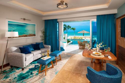 a living room with a couch and a table at Sandals Montego Bay All Inclusive - Couples Only in Montego Bay