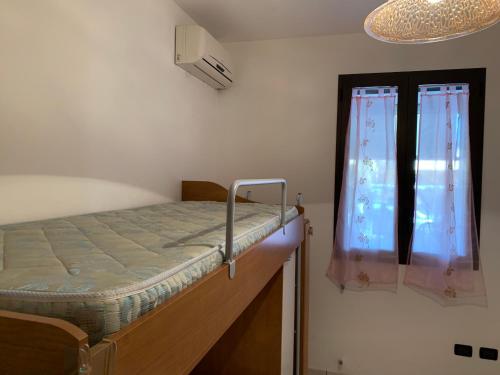 Postel nebo postele na pokoji v ubytování Torre Lapillo