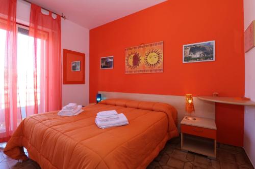 Giường trong phòng chung tại B&B Spiaggia di Ponente