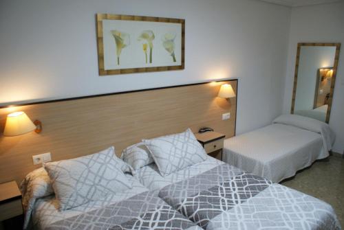 Postel nebo postele na pokoji v ubytování Hotel Carabela 2