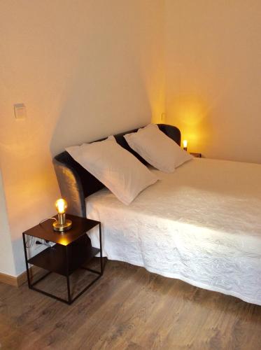 Ένα ή περισσότερα κρεβάτια σε δωμάτιο στο Appartement Doria
