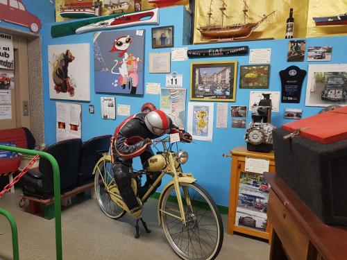 a room with a bike with a man on it at B&B 500 Miglia  in Tempio Pausania