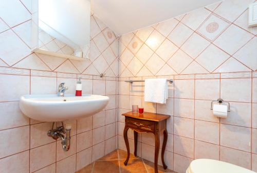 a bathroom with a sink and a toilet at Villa Korina in Pinezici