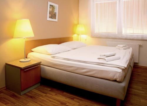 Postel nebo postele na pokoji v ubytování Sedlecký Dvůr