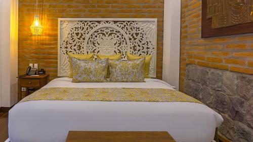 Una cama o camas en una habitación de Hotel Otavalo by Art Hotels