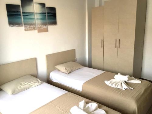 Ένα ή περισσότερα κρεβάτια σε δωμάτιο στο Nikogroup Mona Lisa