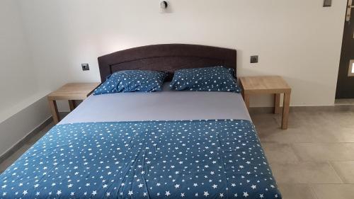 Ένα ή περισσότερα κρεβάτια σε δωμάτιο στο Apartments STAR with Pool