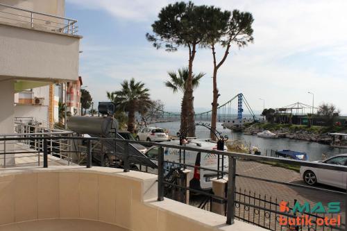 a view of a river with a bridge in the background at Mas Butik Otel in Edremit