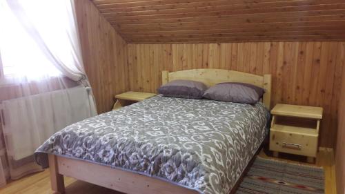 Postel nebo postele na pokoji v ubytování Смерековий двір