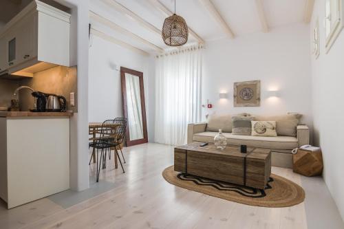 a living room with a couch and a coffee table at Eden View Suites & Villas in Paradise Beach