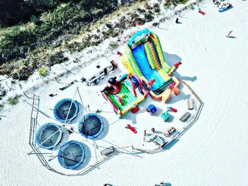 an aerial view of a water park on a beach at Karwia Marina Apartamenty in Karwia
