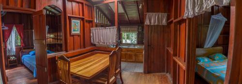 Postel nebo postele na pokoji v ubytování Cabinas Iguana Cahuita